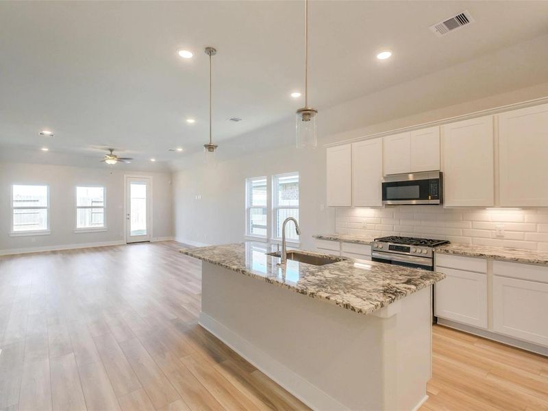 Furnished interior view inside a new home in Sunterra, Katy (Image 8).