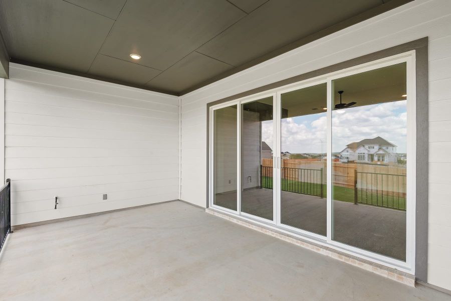 Exterior details and patio area of a home in Lariat, Liberty Hill (Image 23).