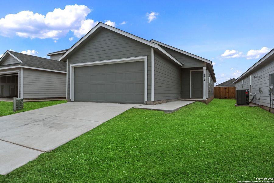 Front exterior of a new home in Torian Village: Belmar Collection, San Antonio, TX, highlighting curb appeal (Image 1).