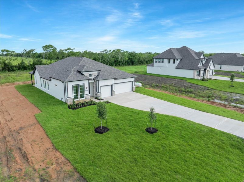 Front exterior of a new home in , Rosharon, TX, highlighting curb appeal (Image 24).