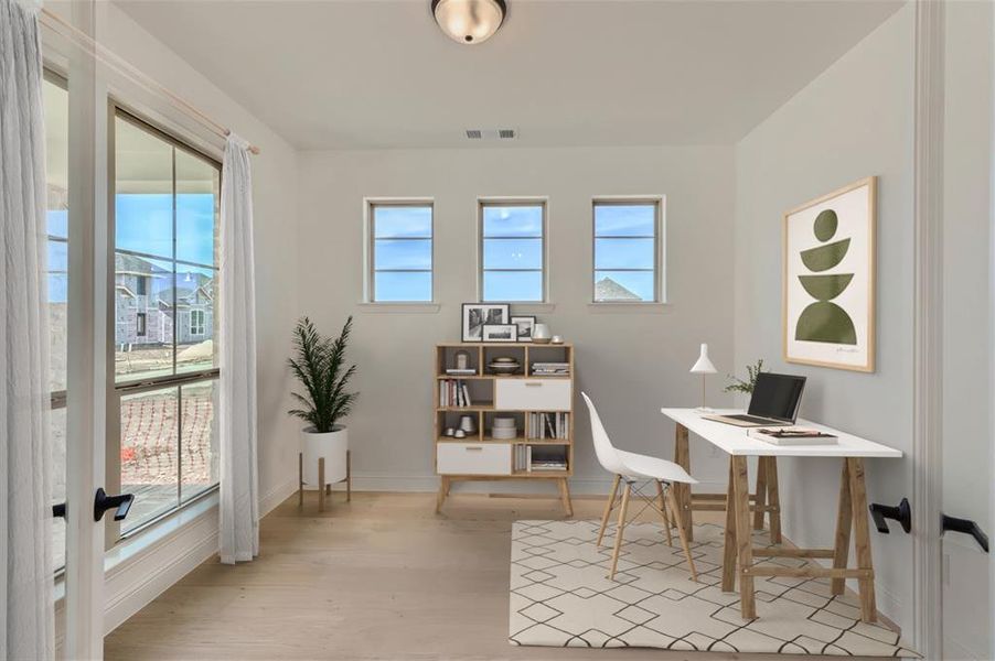 Virtually Staged Photo - Office space featuring a healthy amount of sunlight and light wood-type flooring