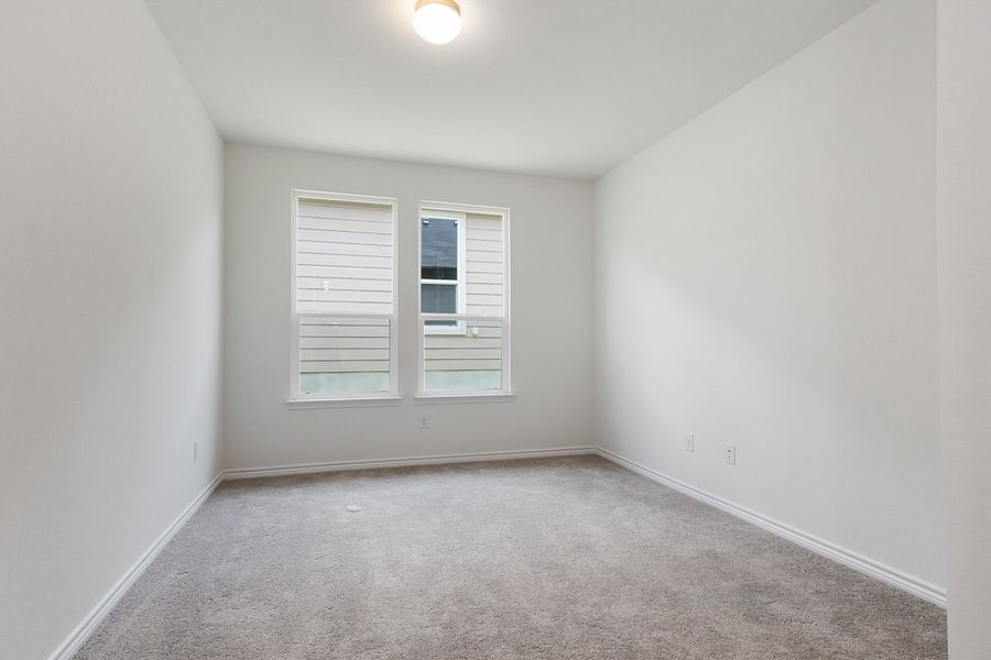 Spacious, unfurnished interior of a new home in Hidden Bluffs at TRP, San Antonio (Image 6).