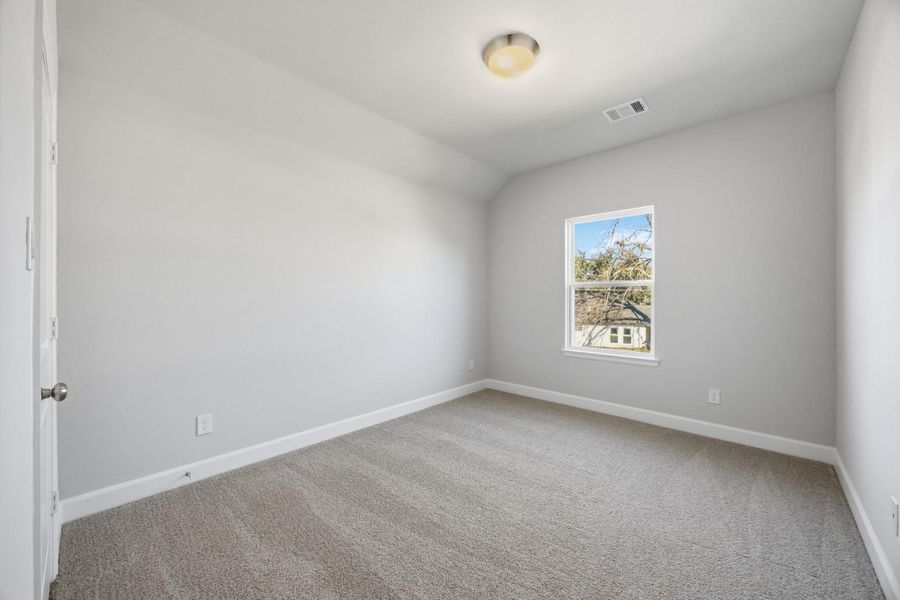 Welcoming Rooms: A Secondary Bedroom serves as a polished oasis for guests or family.