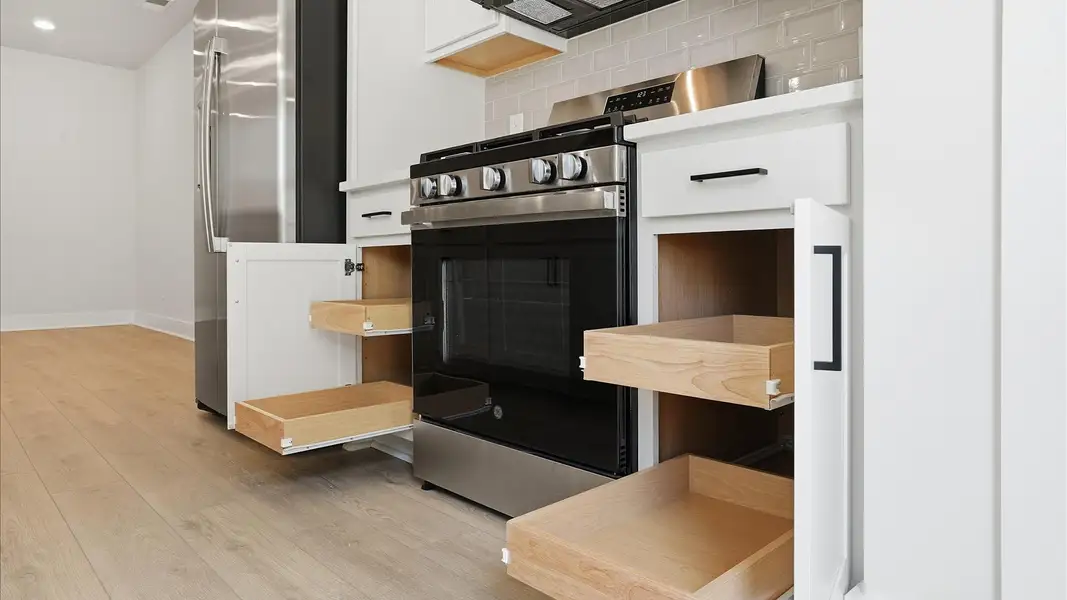Highly skilled craftsmanship shines in this modern kitchen with abundant storage and stainless appliances at Marion Square