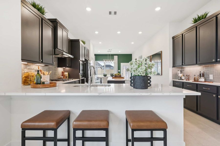 Furnished interior view inside a new home in Sunterra, Katy (Image 15).