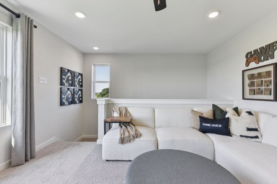 A living room with a couch and a table.