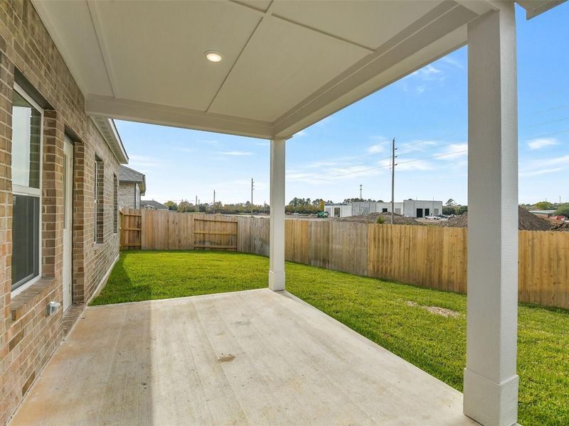 Exterior details and patio area of a home in Windmill Estates, Magnolia (Image 4).