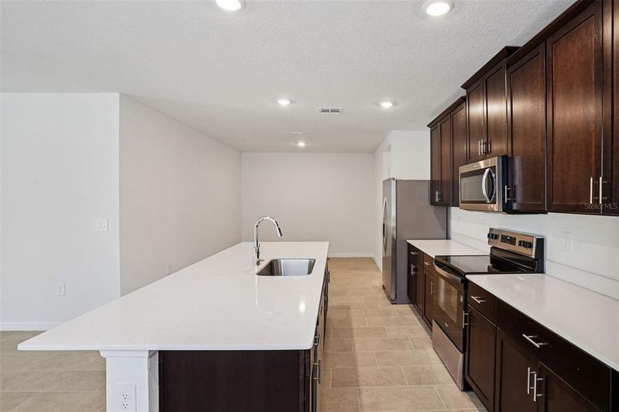 Furnished interior view inside a new home in Ridgehaven - Villas, Ormond Beach (Image 6).