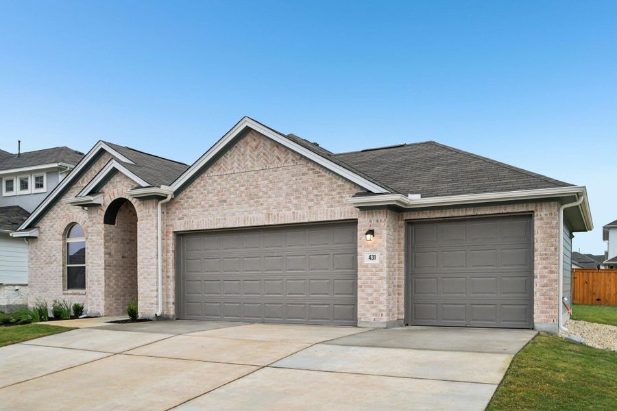 Front exterior of a new home in Crosswinds, Kyle, TX, highlighting curb appeal (Image 17).