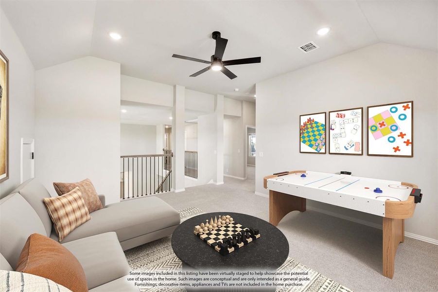 Upstairs game room with air hockey table, sectional sofa, chess set, and ceiling fan near staircase railing