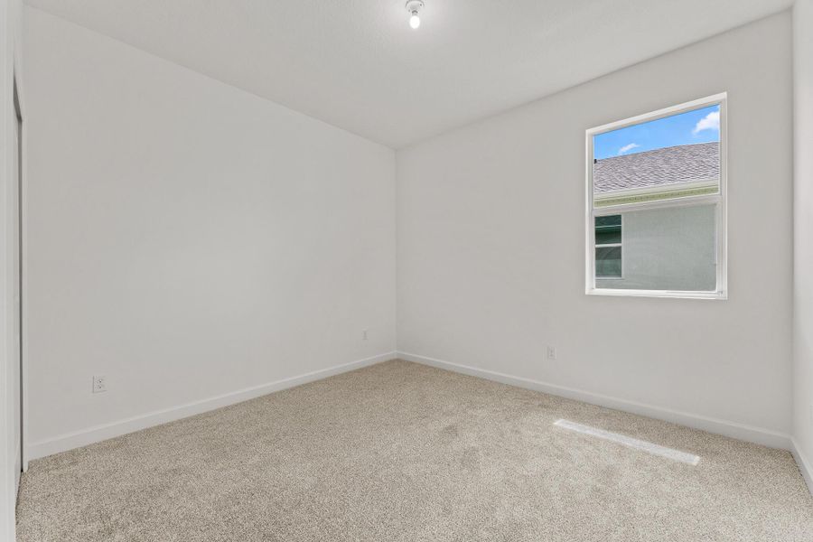 Spacious, unfurnished interior of a new home in Tradition - Cadence, Port St. Lucie (Image 11).