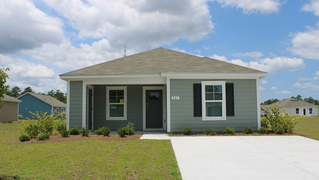 Representative exterior photo of a completed home built from the LEWIS by D.R. Horton in Southshore Bay, Sunset Beach, NC (Image 1).