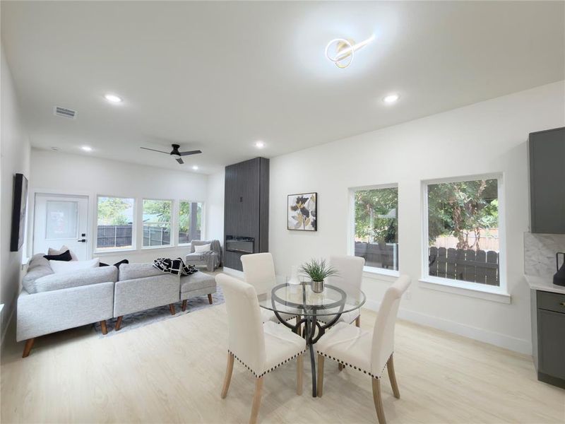 Dining area featuring light wood finished floors, recessed lighting, and a ceiling fan