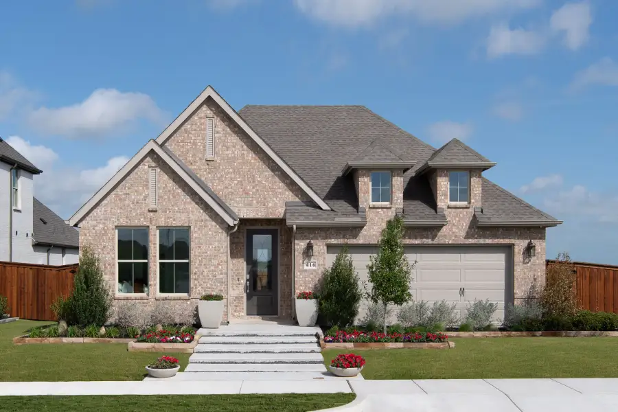 Representative exterior photo of a completed home built from the Savannah by Tri Pointe Homes in Bridgewater, Midlothian, TX (Image 1). Representative exterior photo of a completed home built from the Savannah by Tri Pointe Homes in Bridgewater, Midlothian, TX (Image 1).