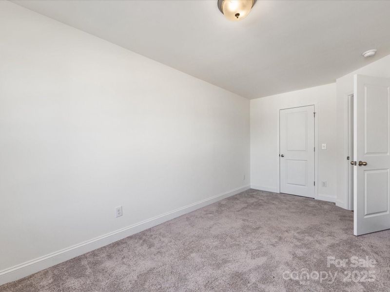 Spacious, unfurnished interior of a new home in Smith Farm, Belmont (Image 20).