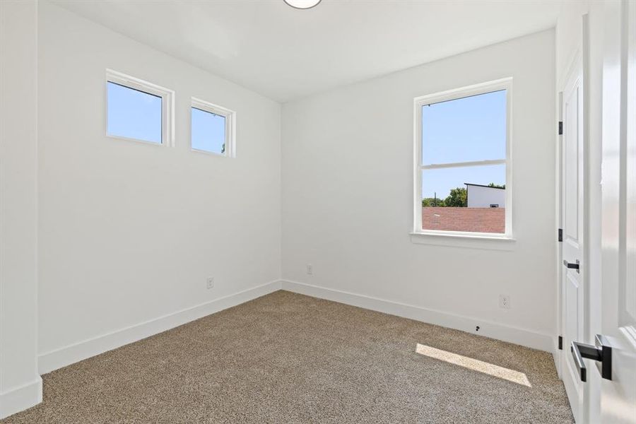 Spare room with carpet floors and healthy amount of natural light