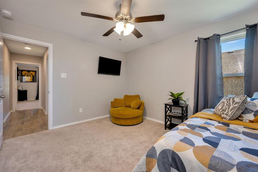 Bedroom featuring carpet flooring and a ceiling fan