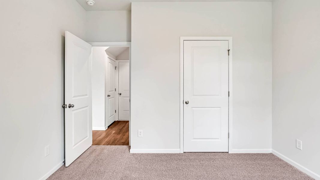 Spacious, unfurnished interior of a new home in Sidbury Station, Castle Hayne (Image 28).