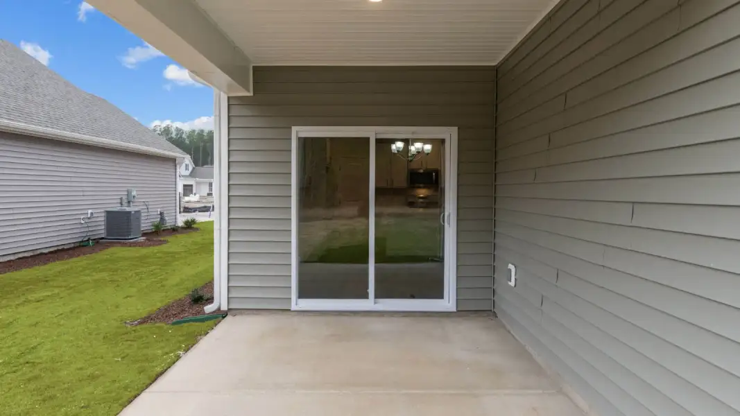 Exterior details and patio area of a home in Chambray, New Bern (Image 18).