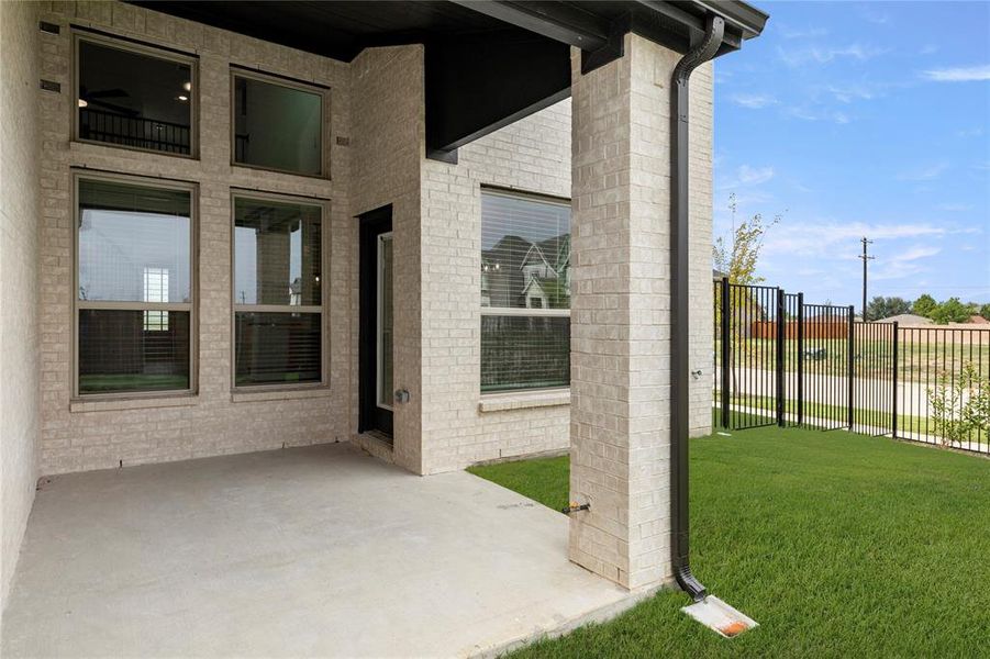 Exterior details and patio area of a home in Villages of Creekwood, Frisco (Image 20).