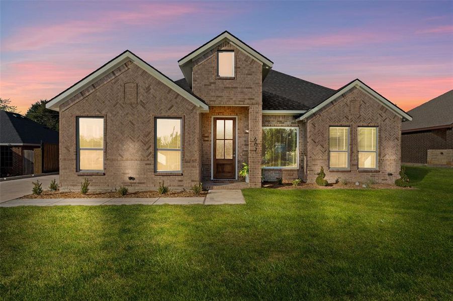Front exterior of a new home in , Glenn Heights, TX, highlighting curb appeal (Image 26). Front exterior of a new home in , Glenn Heights, TX, highlighting curb appeal (Image 26).