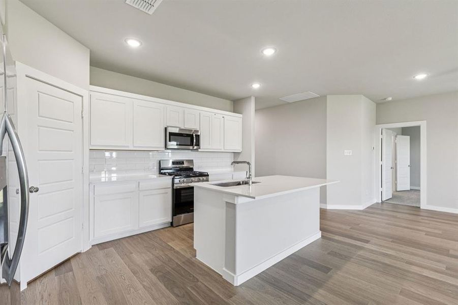 Kitchen in the Harper home plan by Trophy Signature Homes – REPRESENTATIVE PHOTO Kitchen in the Harper home plan by Trophy Signature Homes – REPRESENTATIVE PHOTO