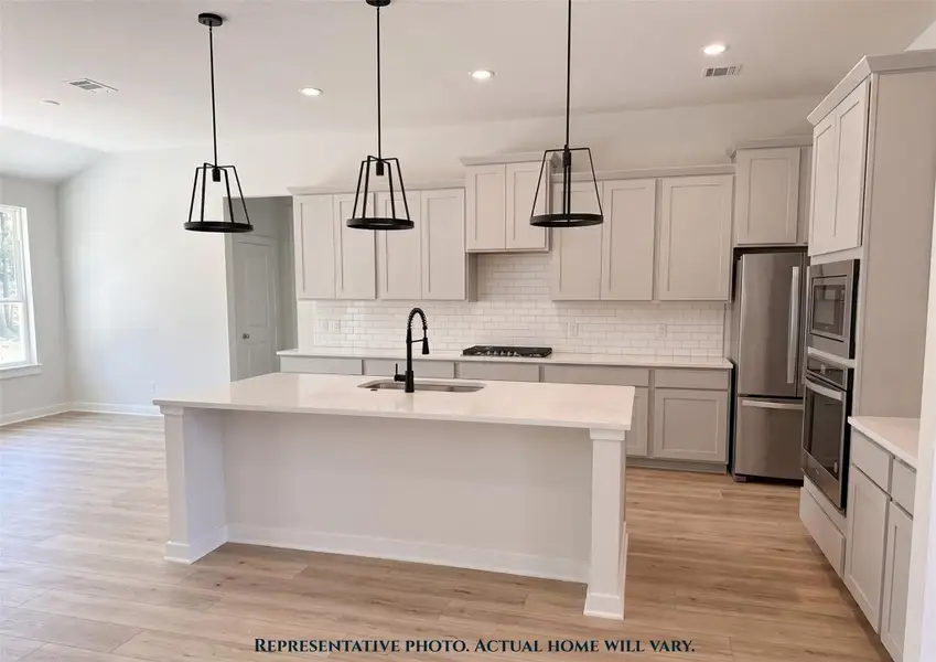 Furnished interior view inside a new home in Pine Rock South, Conroe (Image 2).