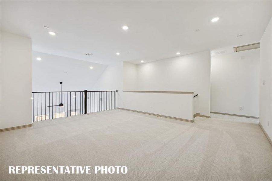 The spacious game room is the perfect place to host those big game day parties!  REPRESENTATIVE PHOTO