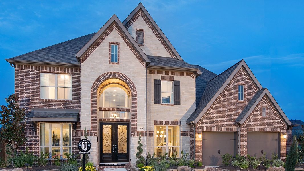 Representative exterior photo of a completed home built from the 4098W by Perry Homes in Valencia, Manvel, TX (Image 21).