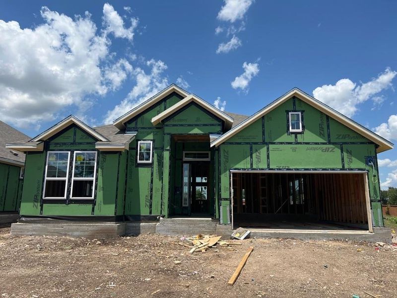 Property in mid-construction featuring an attached garage Property in mid-construction featuring an attached garage