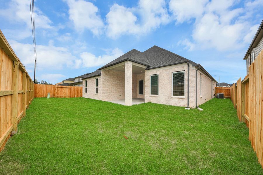 Experience outdoor living at its finest on this expansive covered patio, thoughtfully designed for BBQs and delightful outdoor dining.