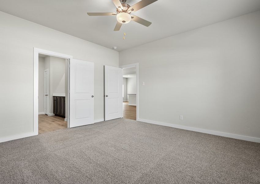 The master suite has a large bedroom, ensuite bathroom and a walk-in closet.