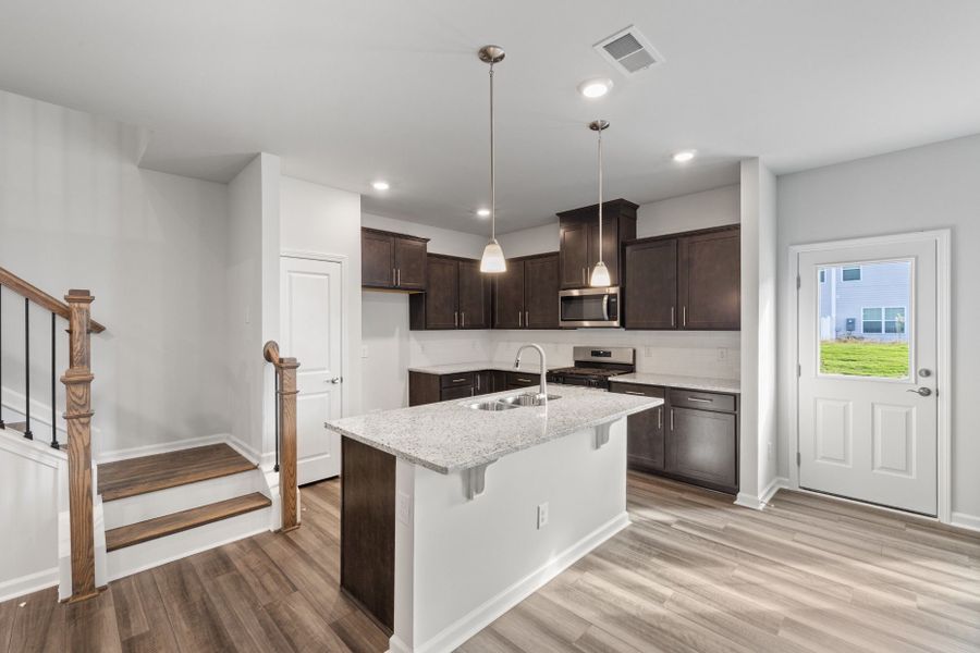 Furnished interior view inside a new home in Poets Walk, Whitsett (Image 9).