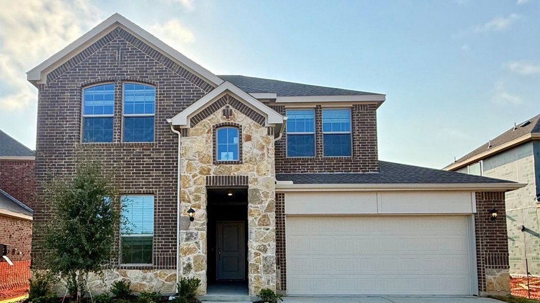 Representative exterior photo of a completed home built from the Tangerine by D.R. Horton in Augusta Square, Fort Worth, TX (Image 19).