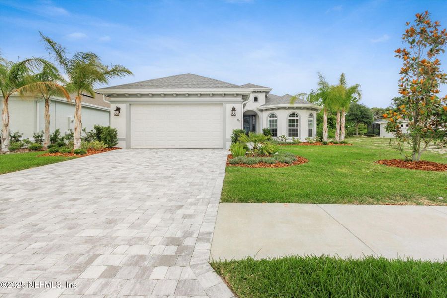 Front exterior of a new home in , Palm Coast, FL, highlighting curb appeal (Image 25). Front exterior of a new home in , Palm Coast, FL, highlighting curb appeal (Image 25).