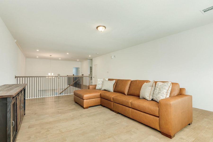 This view highlights the home's spacious open floor plan, offering endless possibilities for furniture arrangement and versatile living arrangements.