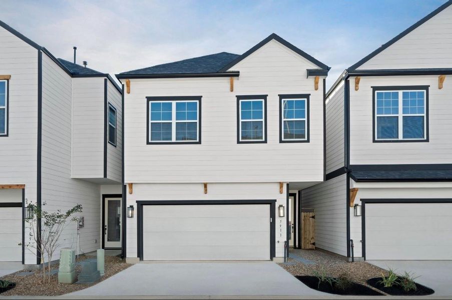 Front exterior of a new home in , Houston, TX, highlighting curb appeal (Image 1).