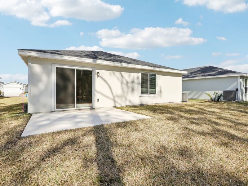 Exterior details and patio area of a home in Flagler Village - Classic Series, Palm Coast (Image 3).