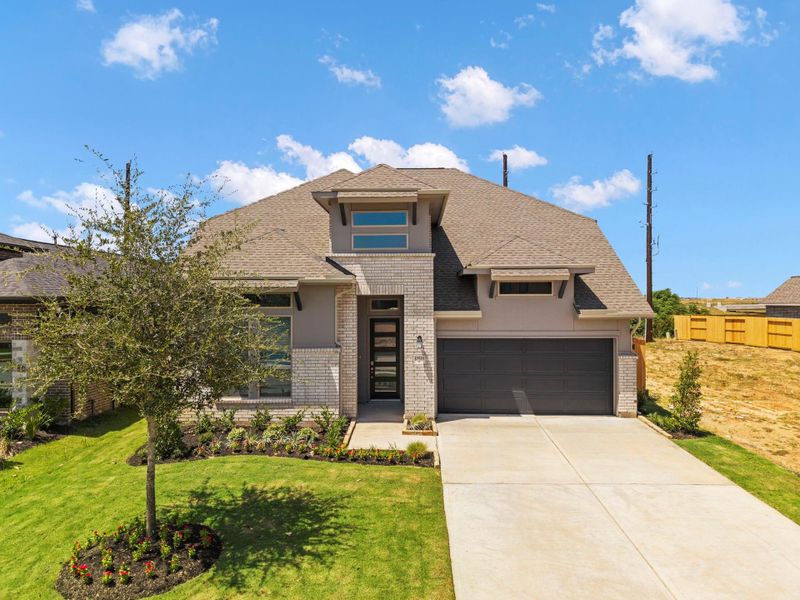 Front exterior of a new home in Candela, Richmond, TX, highlighting curb appeal (Image 25).