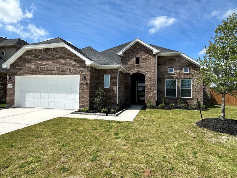 Front exterior of a new home in Creekhaven, Iowa Colony, TX, highlighting curb appeal (Image 1). Front exterior of a new home in Creekhaven, Iowa Colony, TX, highlighting curb appeal (Image 1).