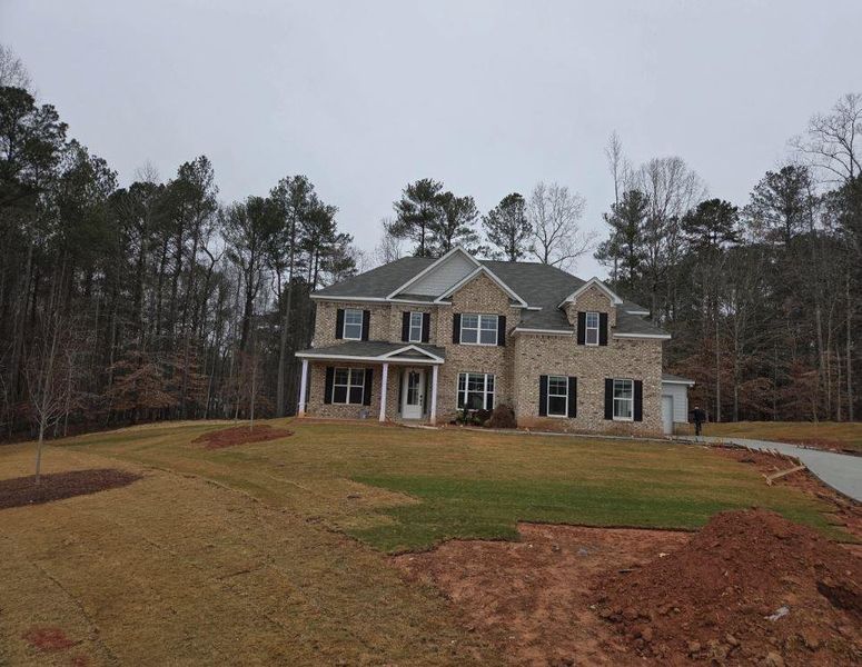 Front exterior of a new home in Ruby Creek Estates, Atlanta, GA, highlighting curb appeal (Image 2).