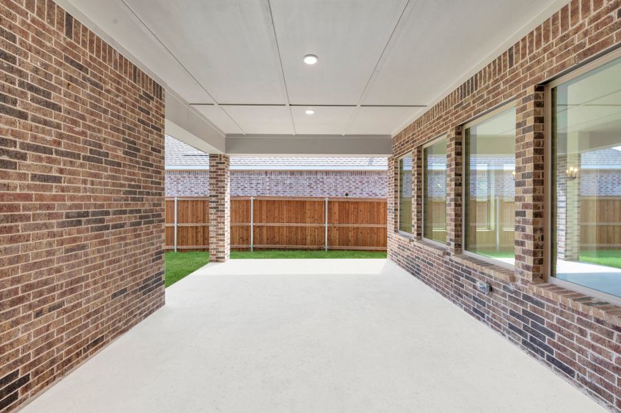 Exterior details and patio area of a home in Elements at Viridian - Traditional Series, Arlington (Image 3). Exterior details and patio area of a home in Elements at Viridian - Traditional Series, Arlington (Image 3).
