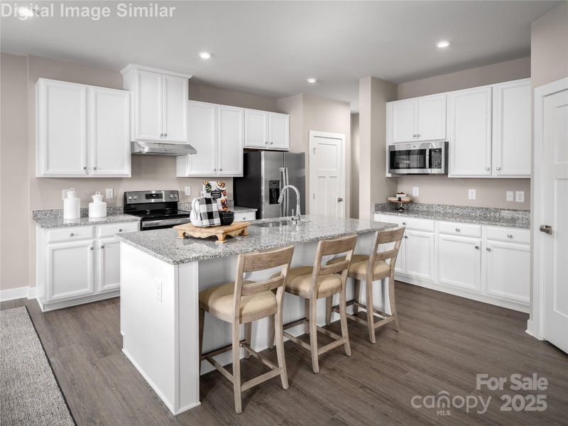 Room for three at the island, granite countertops that shine, extra prep space on the side, and a walk-in pantry to keep it all organized — this kitchen is ready for everyday meals and weekend feasts alike. Room for three at the island, granite countertops that shine, extra prep space on the side, and a walk-in pantry to keep it all organized — this kitchen is ready for everyday meals and weekend feasts alike.