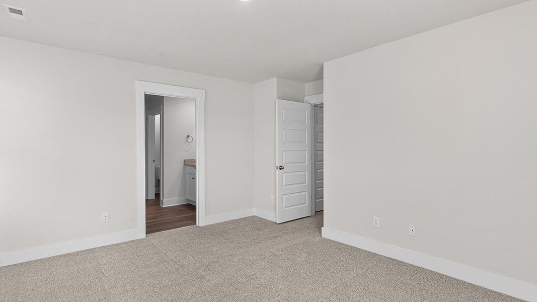 Spacious, unfurnished interior of a new home in The Haven at Indigo Preserve, Leland (Image 25).