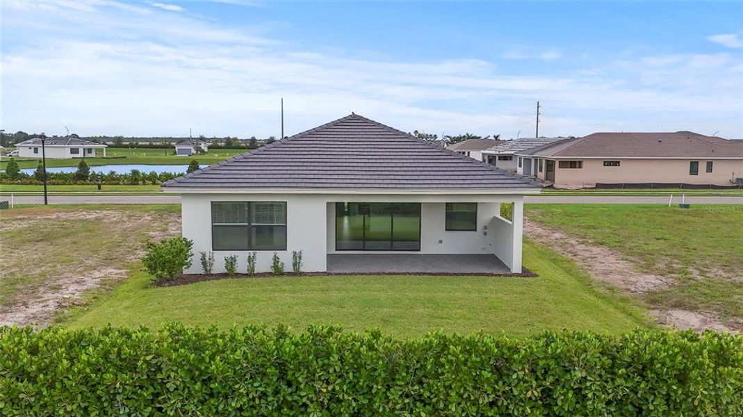 Front exterior of a new home in Cresswind Lakewood Ranch, Lakewood Ranch, FL, highlighting curb appeal (Image 2). Front exterior of a new home in Cresswind Lakewood Ranch, Lakewood Ranch, FL, highlighting curb appeal (Image 2).