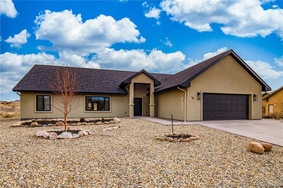 Front exterior of a new home in , Cañon City, CO, highlighting curb appeal (Image 25). Front exterior of a new home in , Cañon City, CO, highlighting curb appeal (Image 25).