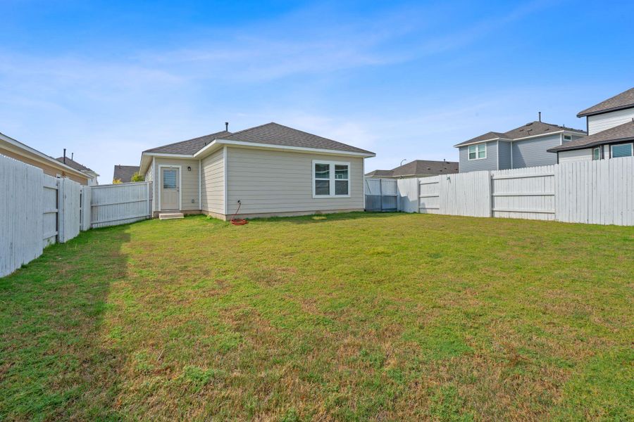 Front exterior of a new home in Harvest Ridge, Elgin, TX, highlighting curb appeal (Image 21).