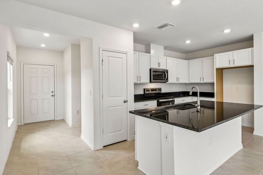 Furnished interior view inside a new home in Reserve at Forest Lake Townhomes, Lake Wales (Image 7).