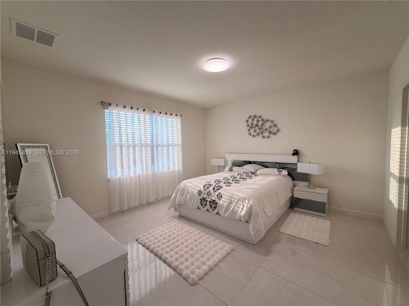 Furnished interior view inside a new home in , Port St. Lucie (Image 28).
