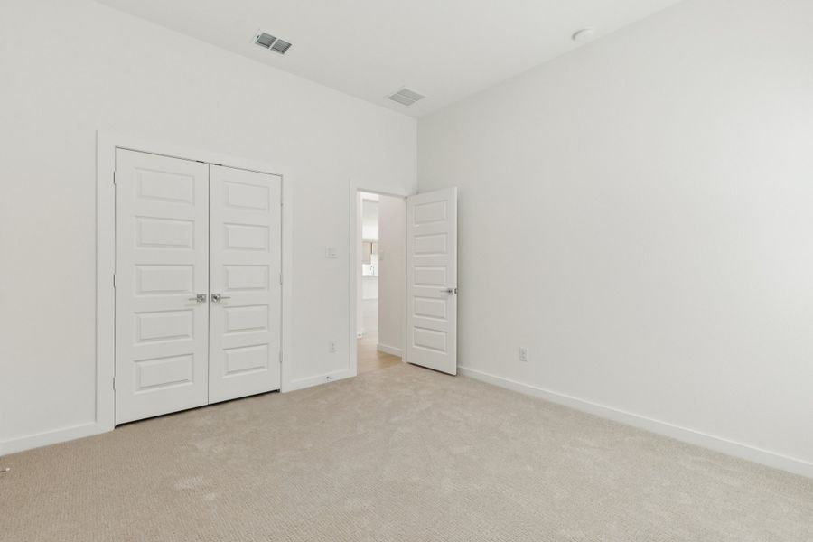 Bedroom in the Gilmour II home plan by Trophy Signature Homes – REPRESENTATIVE PHOTO